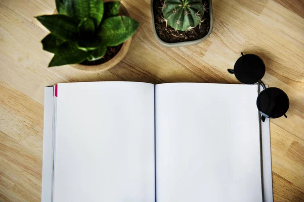 Sketching Notebook on table with plants — Stock Photo, Image