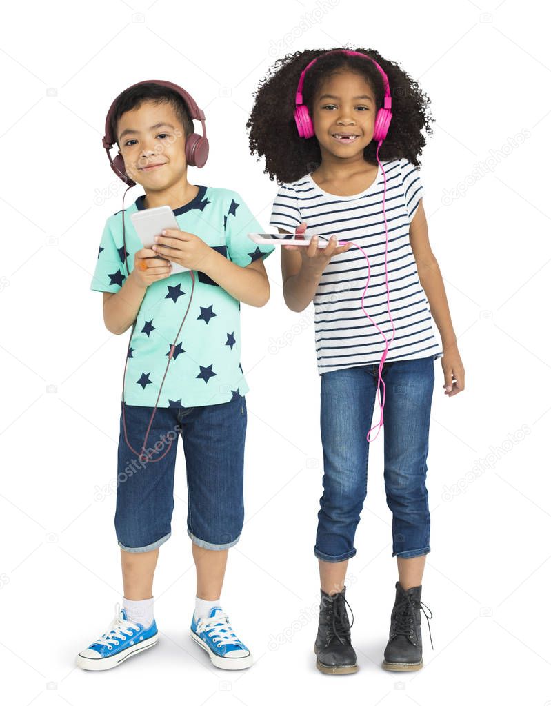 boy and girl listening music in headphones