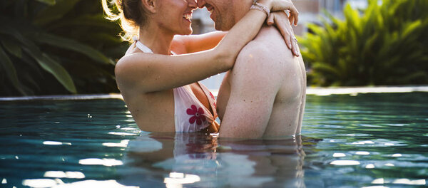 couple resting in pool