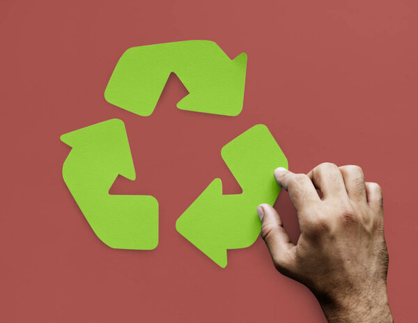 human hand and green arrow