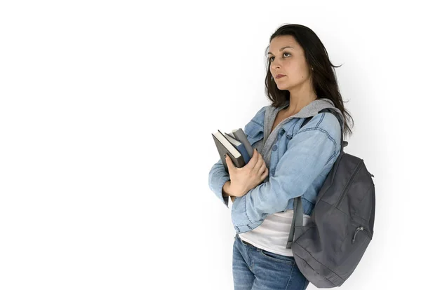 Kvinnlig student med ryggsäck hålla böcker — Stockfoto
