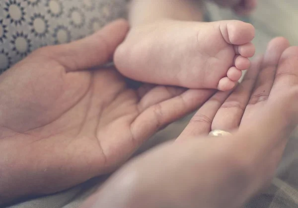 Parents holding hand of newborn baby Stock Photo by ©Rawpixel 153643122