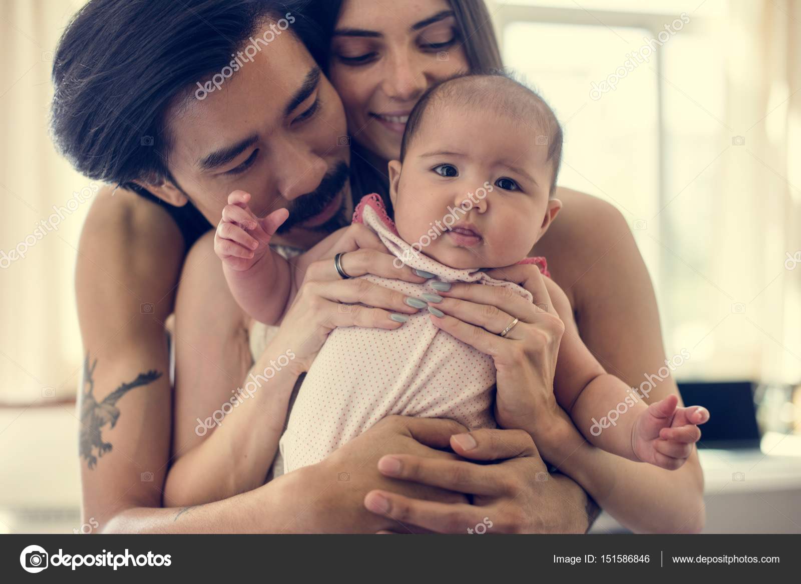 new born baby with parents