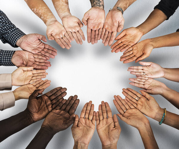 group of human hands assembled in circle