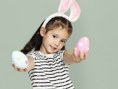 cute little girl with easter eggs