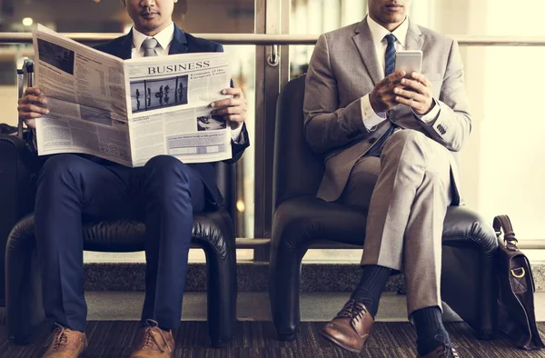 Business Men Reading  Newspaper