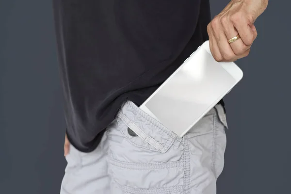 Man taking out smartphone from pocket — Stock Photo, Image