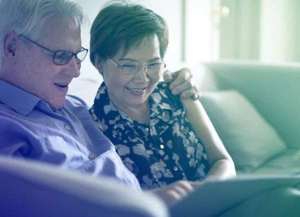 Couple Looking at Photo Album — Stock Photo, Image