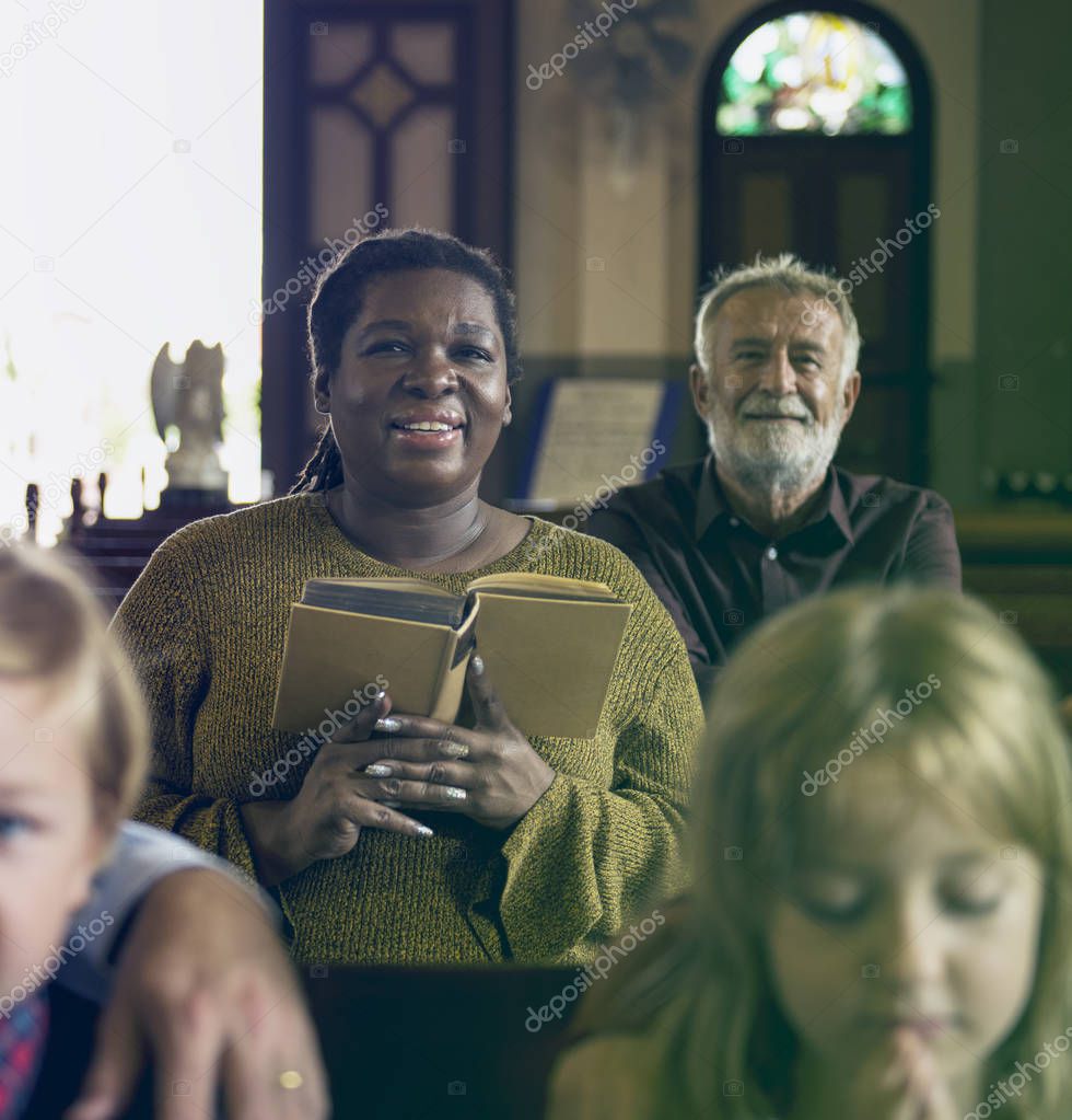 People praying in the Church