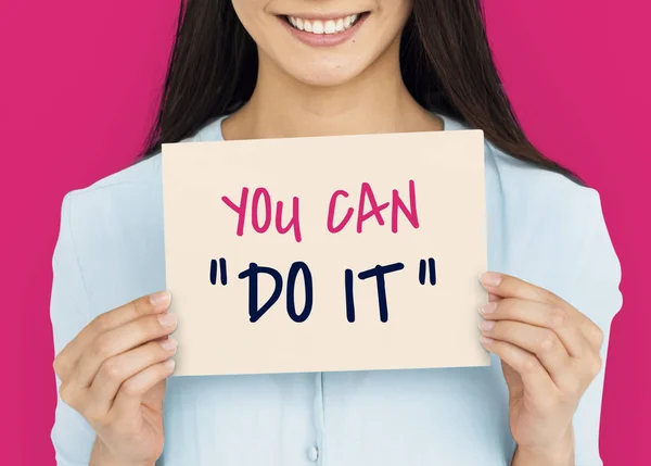 Young woman holding card. — Stock Photo, Image