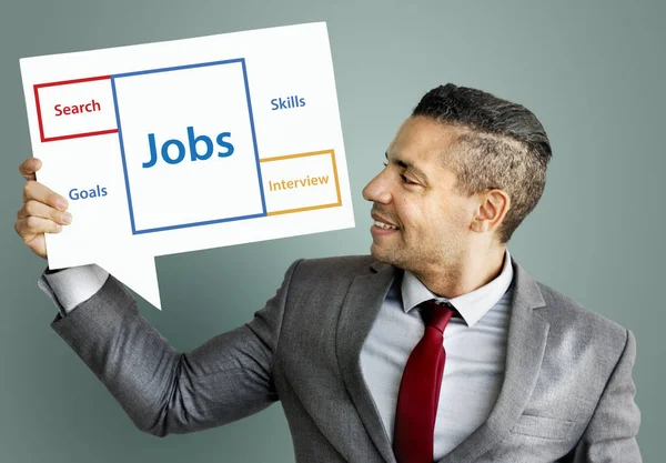 Business man holding speech bubble — Stock Photo, Image