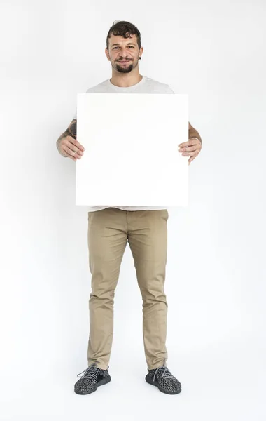 Uomo in possesso di banner bianco vuoto — Foto Stock