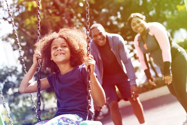 Girl swinging on swing — Stock Photo, Image