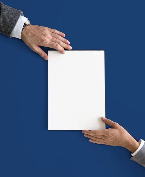 Hands holding white paper blank — Stock Photo, Image