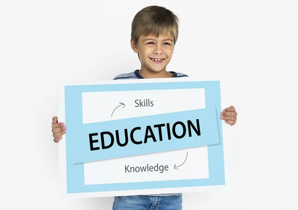 Boy holding placard — Stock Photo, Image