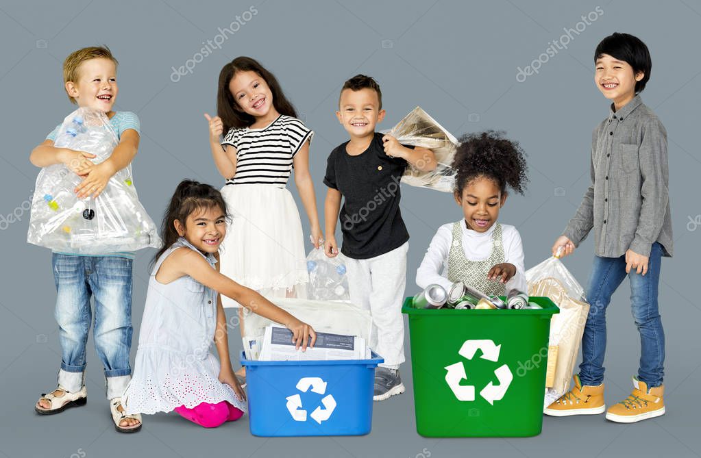 Diverse Group Of Kids Recycling Garbage, Studio Portrait