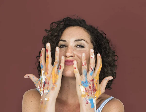 Woman with hands in colorful paint — Stock Photo, Image