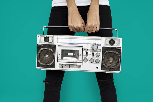 woman holding radio