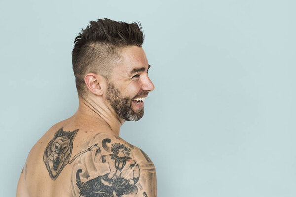 man with tattoos on back
