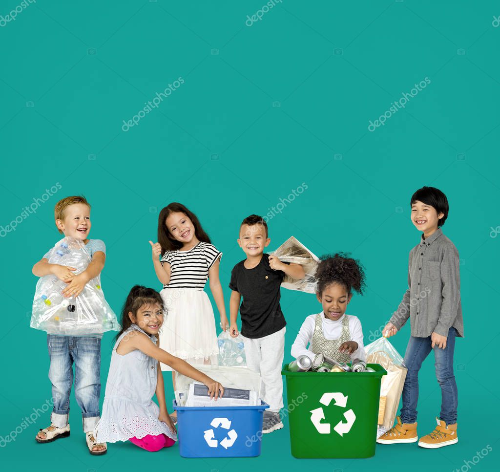 Diverse Group Of Kids Recycling Garbage, Studio Portrait
