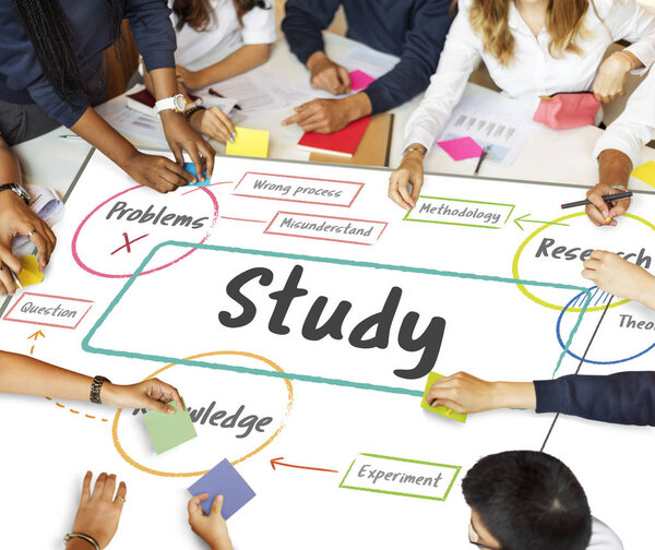 Students working and studying at table