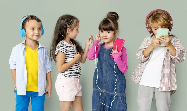 Kids listening music with headphones — Stock Photo, Image