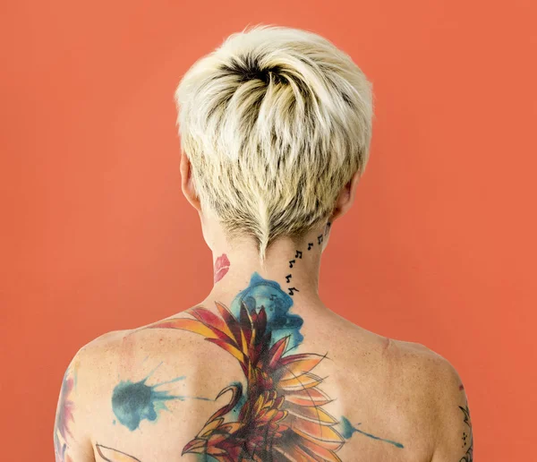 Tattooed woman with bare shoulders — Stock Photo, Image