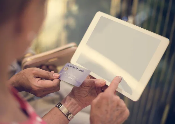 Senior Woman holding Tablet