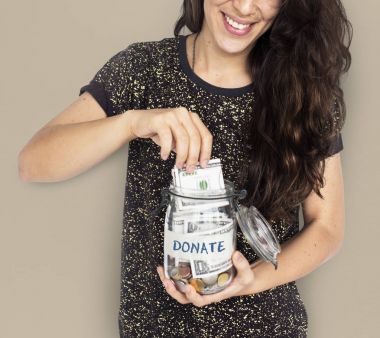 woman putting money in jar clipart