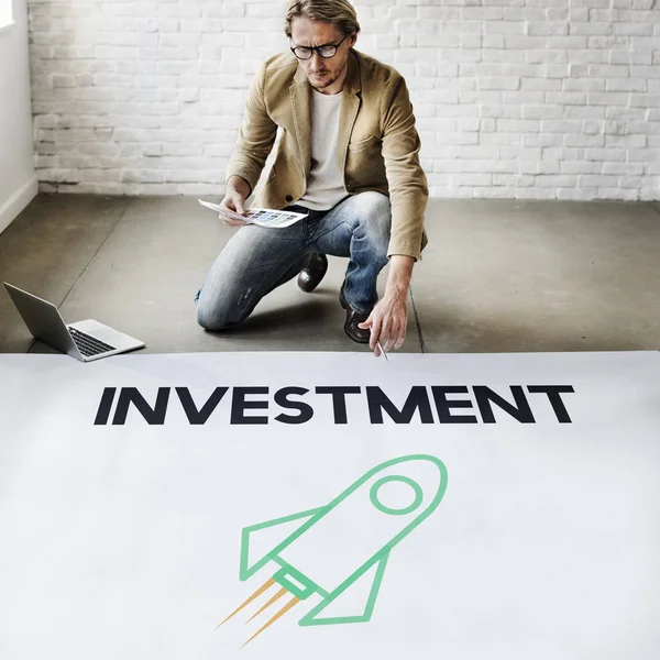 Businessman working near poster — Stock Photo, Image