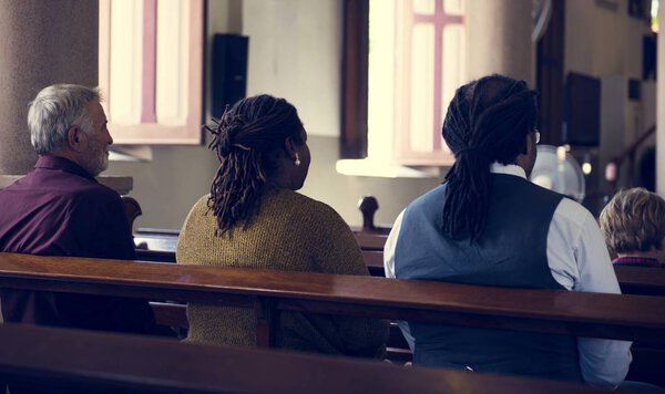 People praying in the Church