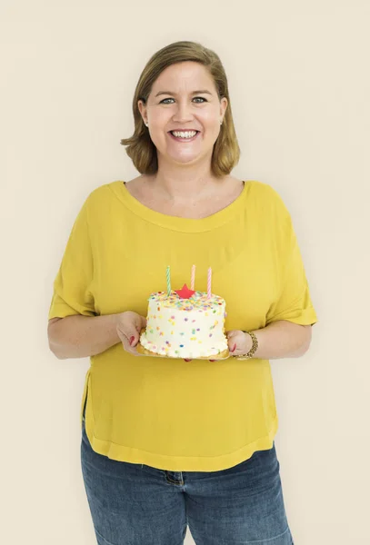 woman holding birthday cake