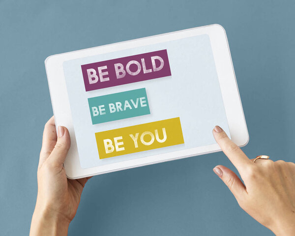 person holding digital tablet