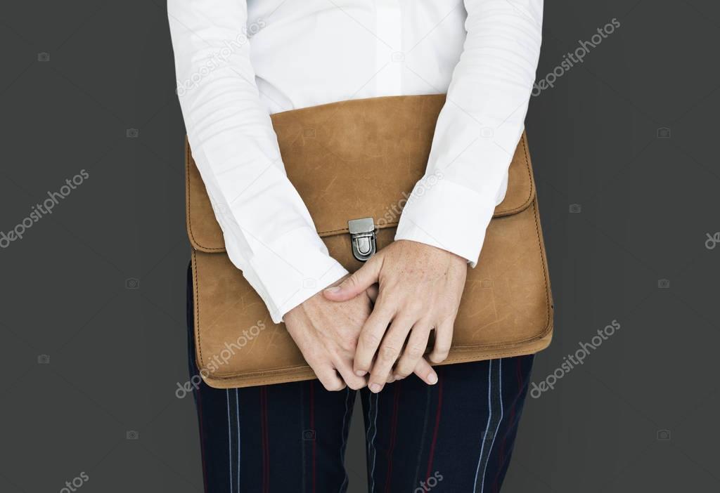 woman holding Brown Folder Bag 