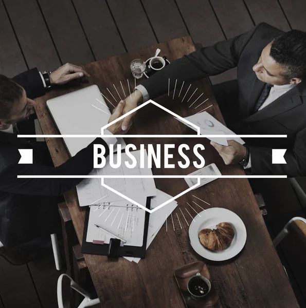 Businesmen shaking hands at meeting — Stock Photo, Image