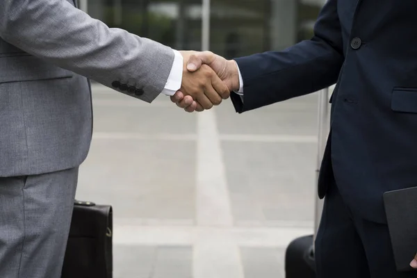 Business Men Agreement Deal with Hands Shake