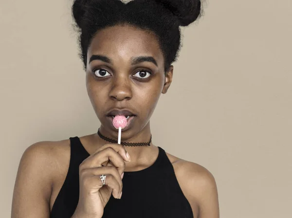 Teenage girl eating lollipop — Stock Photo, Image