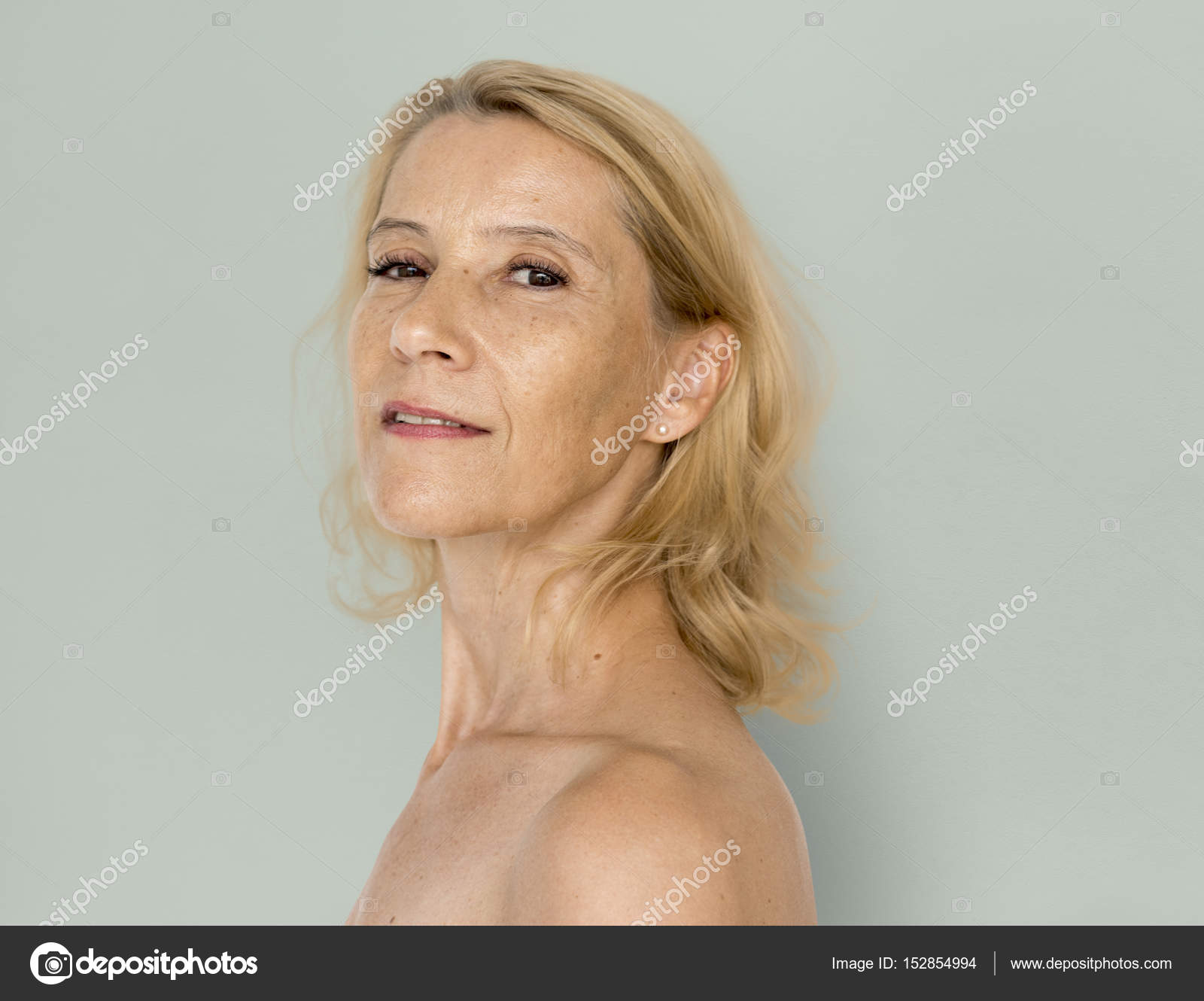 Mature blonde woman looking at camera Stock Photo by ©Rawpixel 152854994