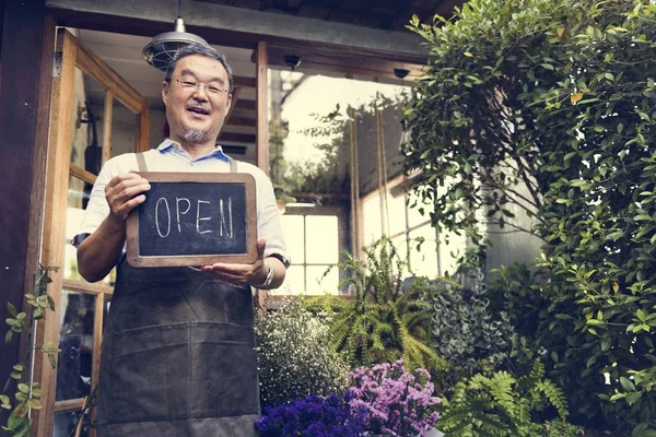 Man holding open sign — Stock Photo, Image