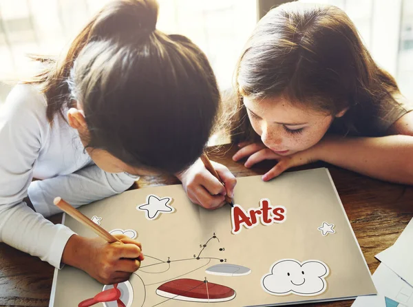 Two girls drawing airplane — Stock Photo, Image