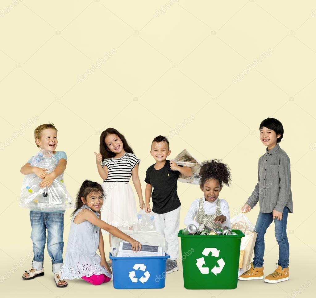 Diverse Group Of Kids Recycling Garbage