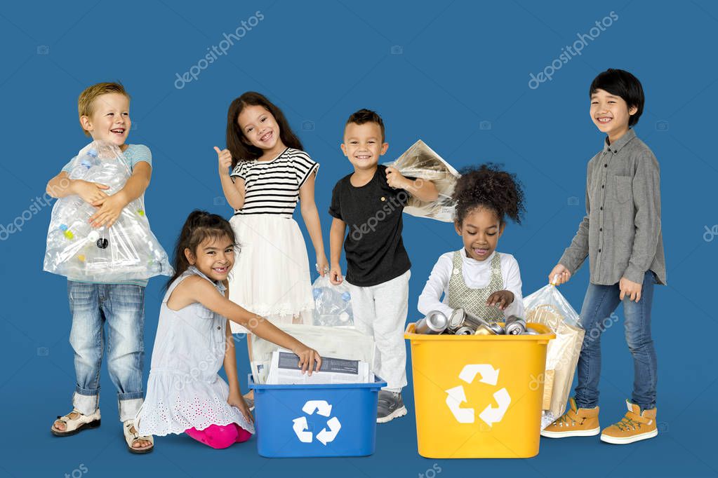 Diverse Group Of Kids Recycling Garbage, Studio Portrait