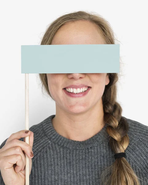 Woman covering eyes with banner — Stock Photo, Image