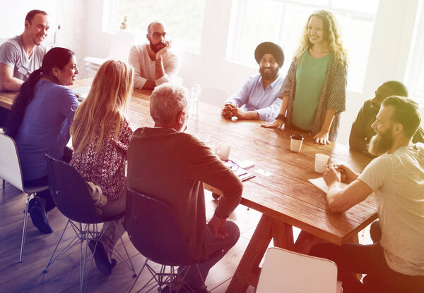 people sitting at table on business meeting