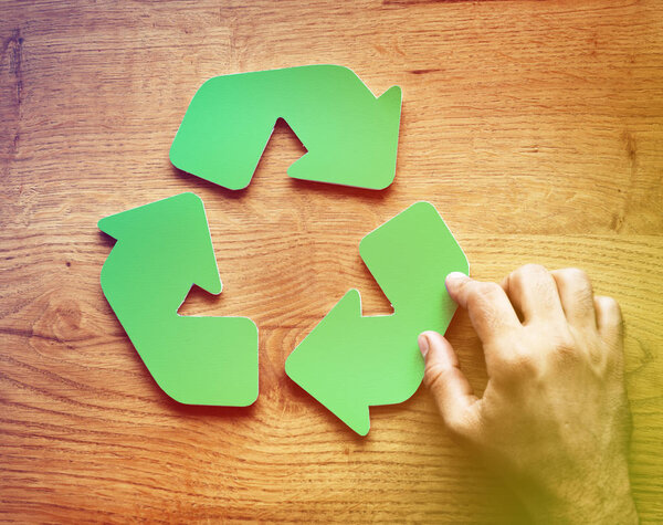 Hand and Recycling Sign