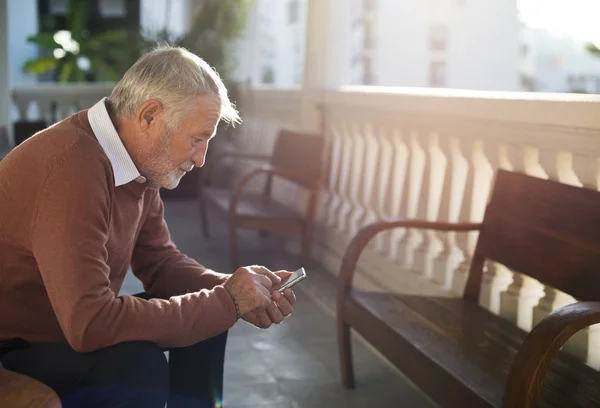 senior man using smartphone