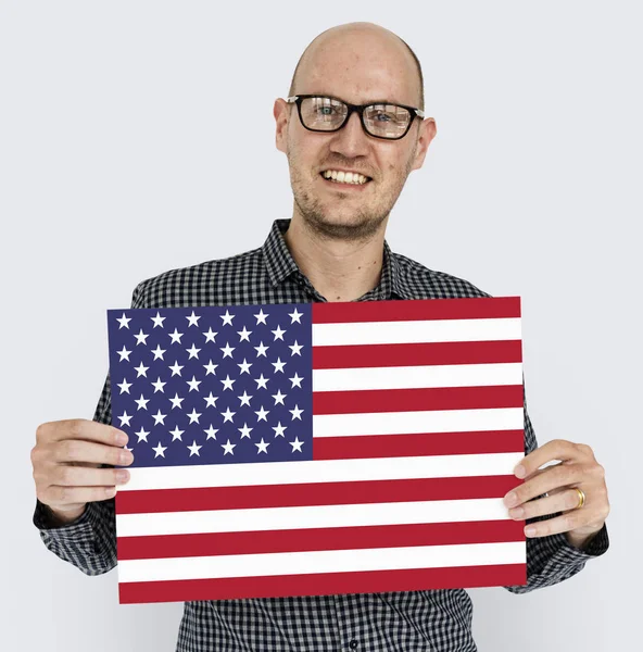 Mature man holding USA  flag. — Stock Photo, Image