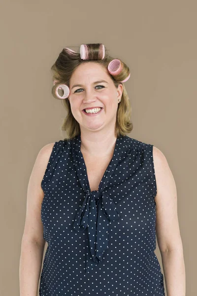 caucasian woman with hair rollers