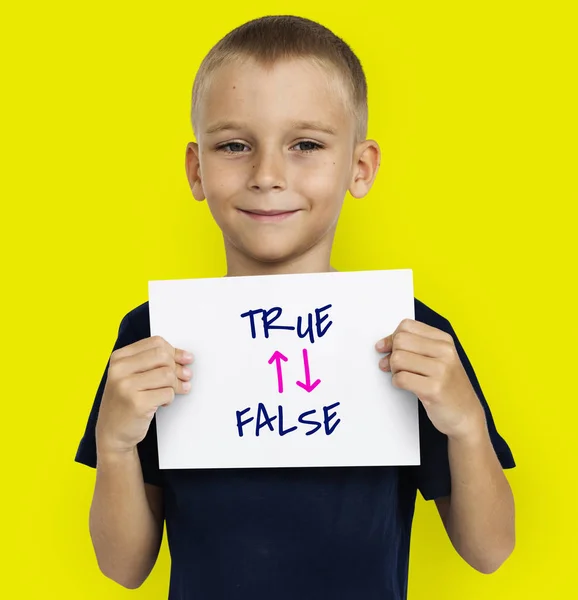 Boy holding placard — Stok Foto