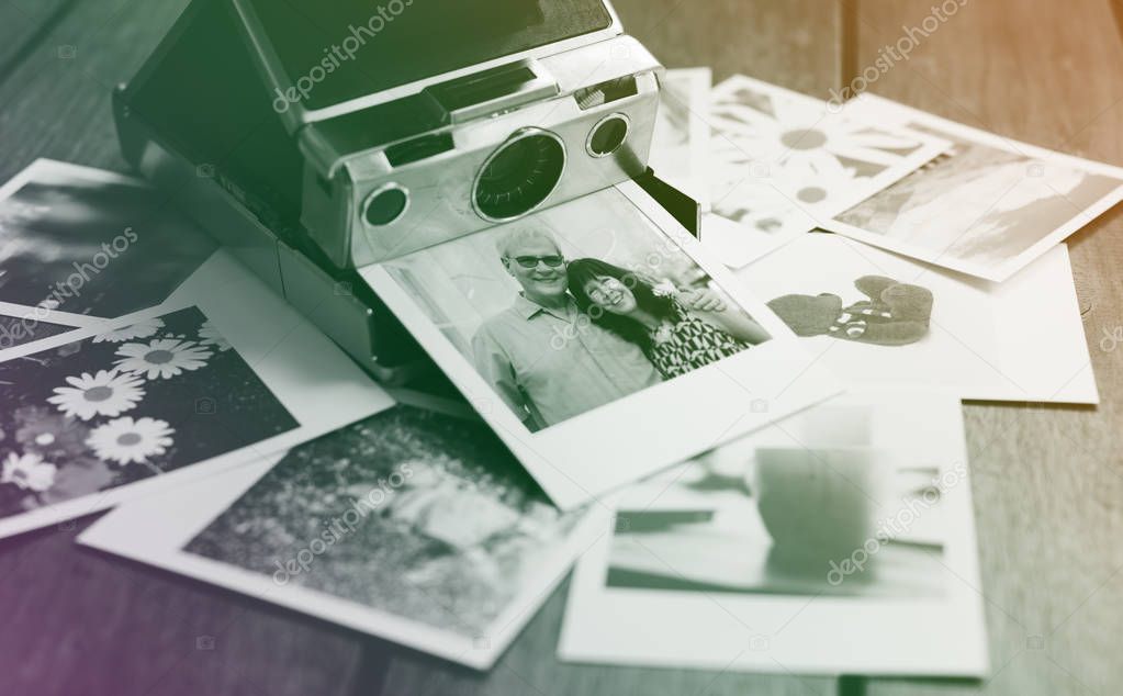 Messy pile of instant photo prints